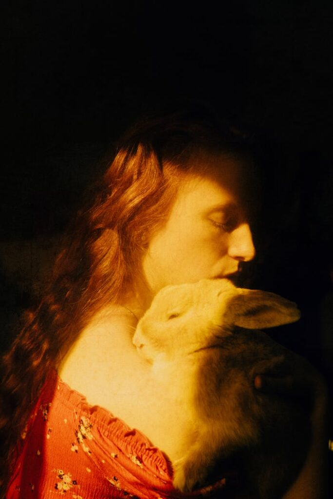 Painting of dreamy woman with rabbit on sunny day